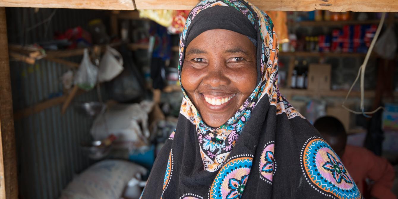 A woman stands outside her shop in Fadhi Gaab area in Somaliland. Allan Gichigi/Oxfam