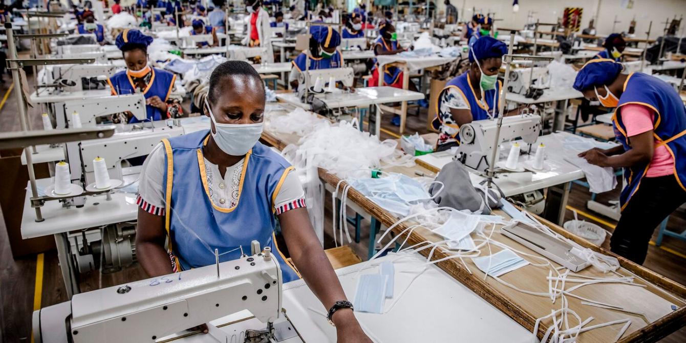 A worker produces face masks at the Kitui County Textile Center in Kitui, Kenya, which was converted to produce masks. Photo by Luis Tato/AFP/Getty Images. Source: Washington Post. A worker produces face masks at the Kitui County Textile Center in Kitui, Kenya, which was converted to produce masks. Photo by Luis Tato/AFP/Getty Images. Source: Washington Post.