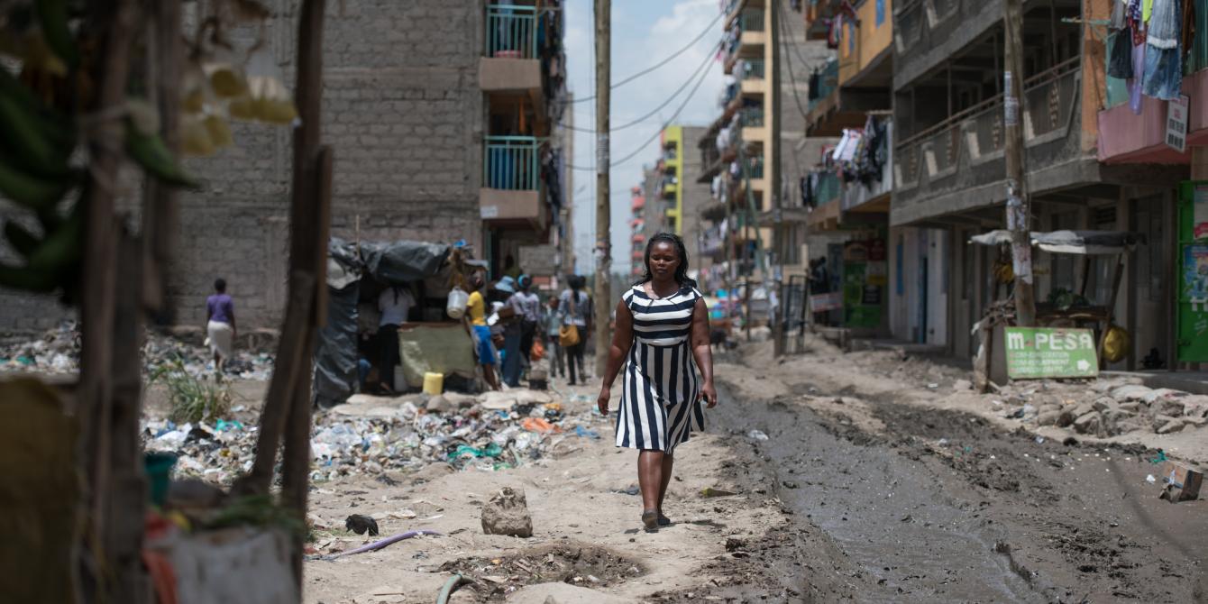 Elizabeth Wayua, 31, a domestic worker arrives at her employer's house to start her chores in Pipeline, Embakasi, Nairobi, Kenya. 2016. Photo Credit: Allan Gichigi Elizabeth Wayua, 31, a domestic worker arrives at her employer's house to start her chores in Pipeline, Embakasi, Nairobi, Kenya. 2016. Photo Credit: Allan Gichigi
