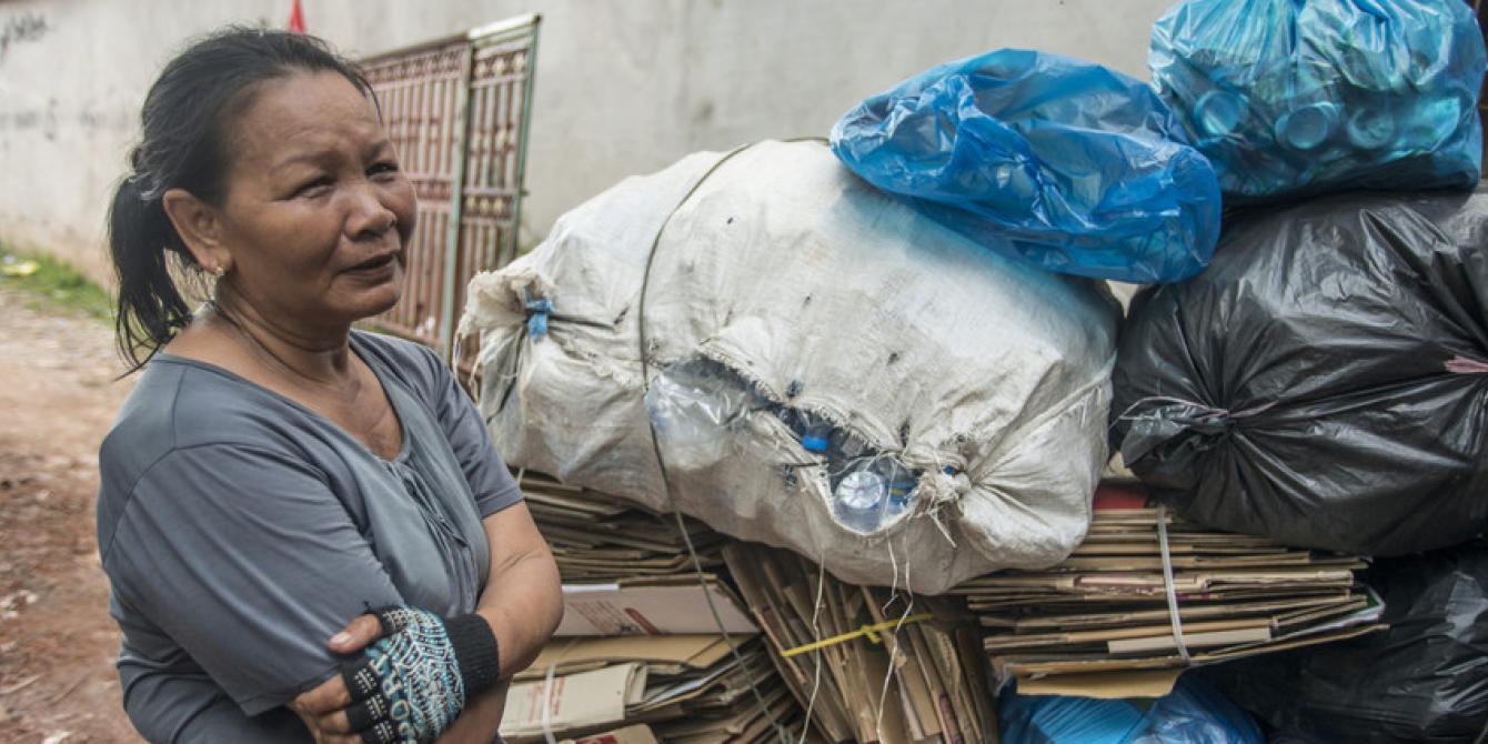 Saving Groups by Informal Workers, for Informal Workers Ms. Thong shows her waste cart