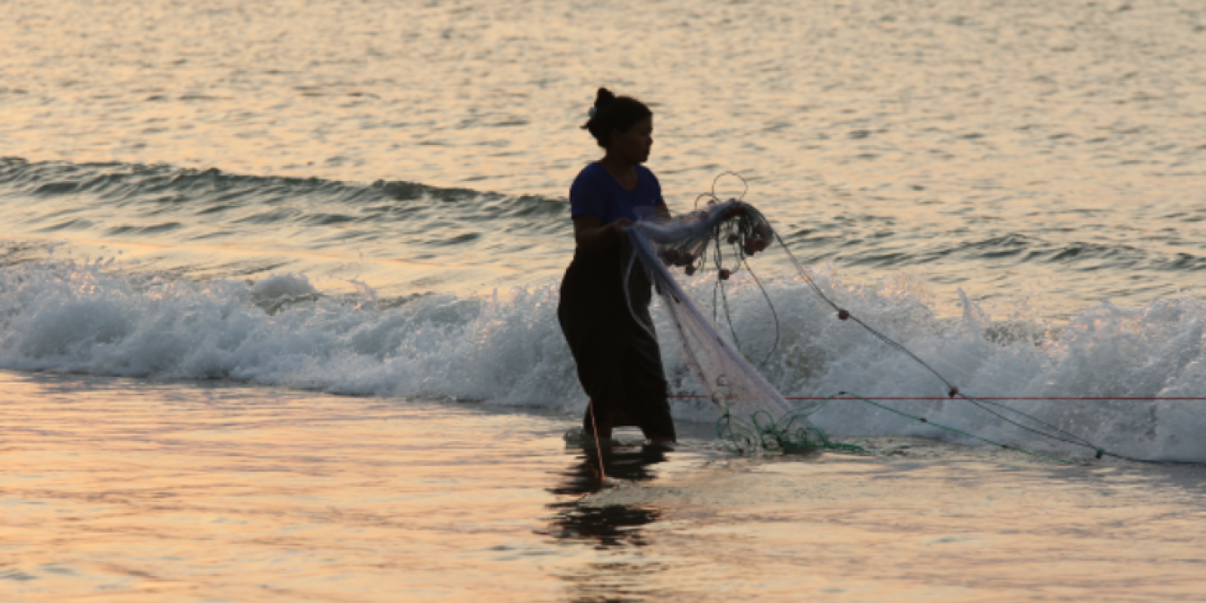 Local Women carrying a fishing net in Kyauk Phyu, Rakhine state Local Women carrying a fishing net in Kyauk Phyu, Rakhine state