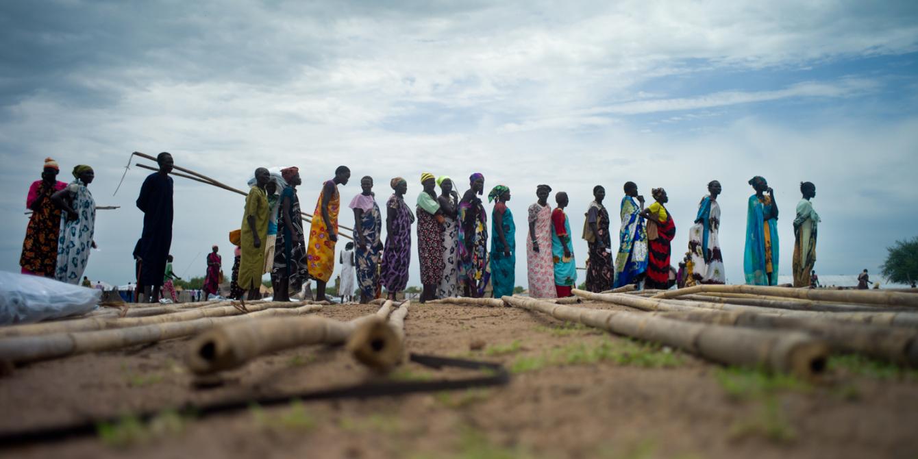 Internally displaced persons receiving humanitarian supplies in a camp in Juba, South Sudan Internally displaced persons receiving humanitarian supplies in a camp in Juba, South Sudan