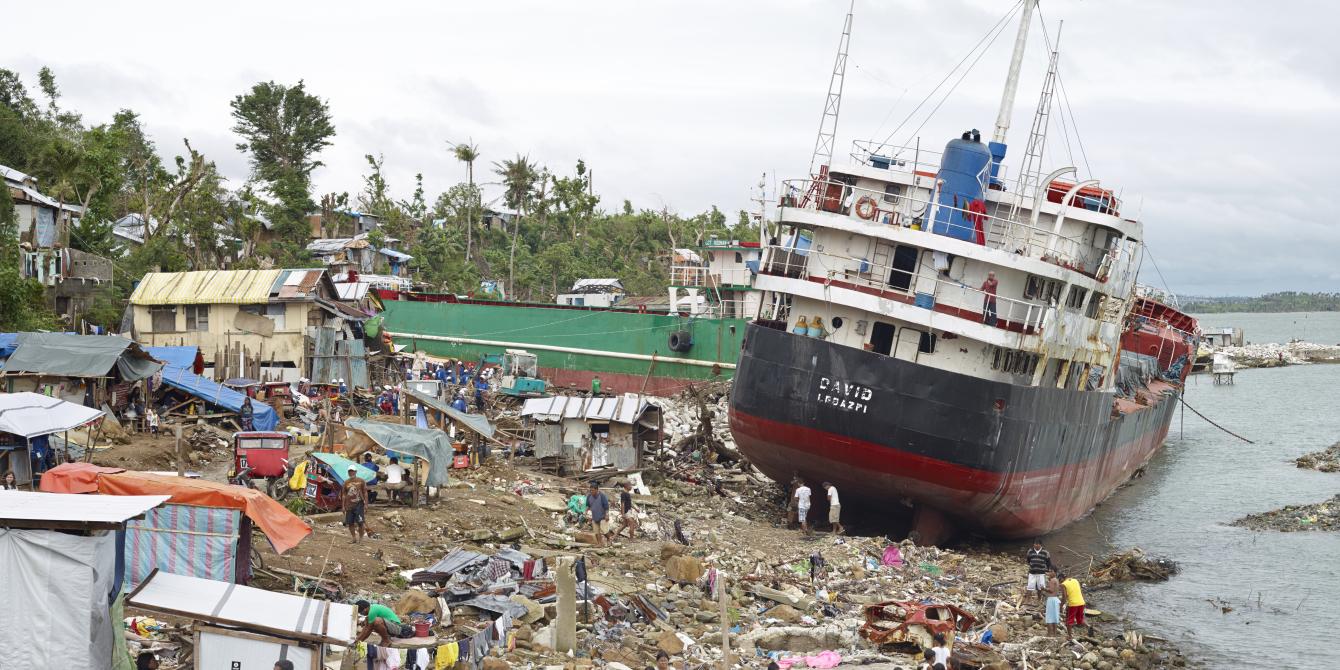 In Anibong hundreds of people were killed when the storm surge destroyed dwellings and washed giant container ships ashore. Before the storm the government issued a 'storm surge' warning, however many residents did not understand the term and did not evacuate to higher ground. Survivors were left homeless and without access to clean water and sanitation facilities. Oxfam is one of the leading agencies working to ensure people have safe water, hygiene and sanitation facilities (WASH work) following typhoon Haiyan. Within the first three months of Oxfam’s response, over 200,000 people had been provided with clean water and over 8,500 people had received water kits. Oxfam distributed over 60,000 hygiene kits to affected communities, meaning 300,000 people had the essential supplies they needed to stay clean and healthy. Hygiene kits contain soap, detergent, sheets, underwear, sanitary towels, toothpaste, and toothbrushes. Photo:Simon Roberts/Oxfam In Anibong hundreds of people were killed when the storm surge destroyed dwellings and washed giant container ships ashore. Before the storm the government issued a 'storm surge' warning, however many residents did not understand the term and did not evacuate to higher ground. Survivors were left homeless and without access to clean water and sanitation facilities. Oxfam is one of the leading agencies working to ensure people have safe water, hygiene and sanitation facilities (WASH work) following typhoon