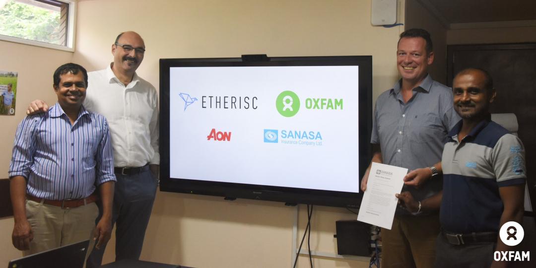Oxfam, Etherisc, AON and Sanasa Insurance representatives at the official launch of the insurance platform Oxfam, Etherisc, AON and Sanasa Insurance representatives at the official launch of the insurance platform
