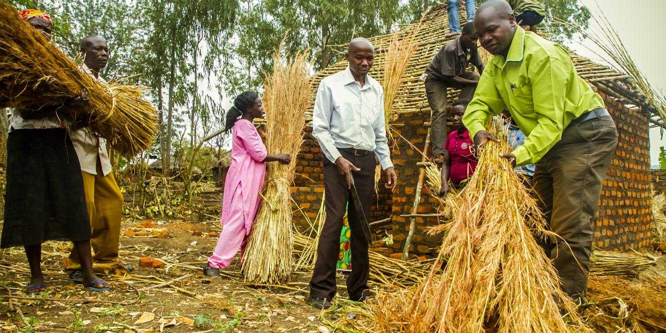 Members of RAFODA Neighbourhood assembly in Gulu district involved in constructing a house for one of their members. Photo credit: Oxfam photos